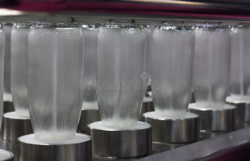 Glass Bottles in Cleaning Process Spraying by High Pressure Water Stock