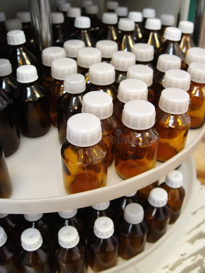 Bottles with white screw-top for a medicine