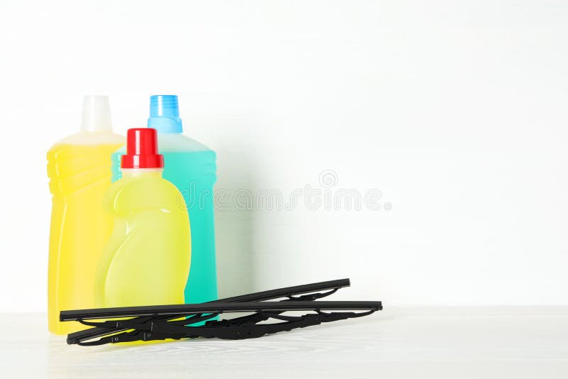 Bottles of Windshield Washer Fluids and Wiper on Yellow Background. Space  for Text Stock Photo - Image of vehicle, space: 214385568