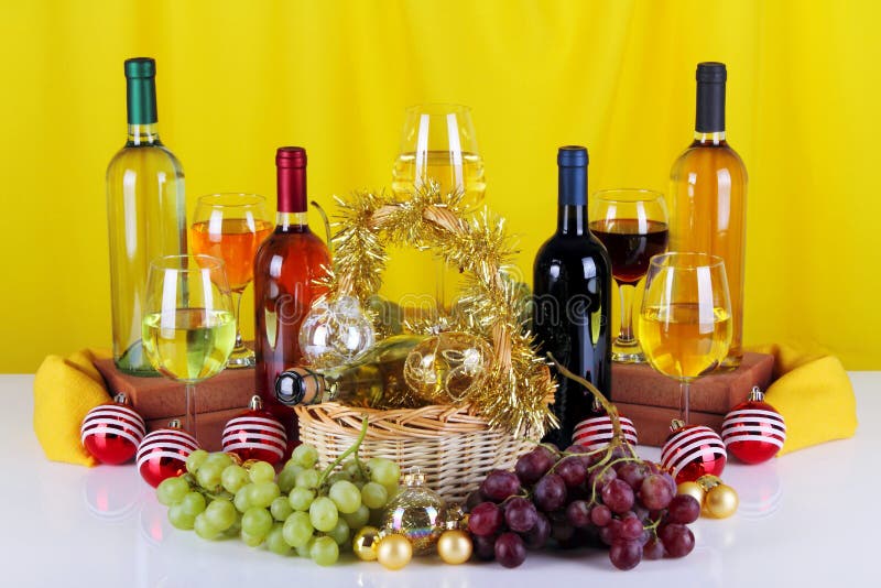 Bottles of wine with grapes and Christmas decorations