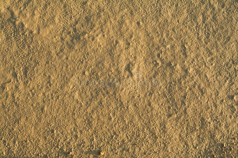 Fine grained dried mud background - in sunset lights. Fine grained dried mud background - in sunset lights