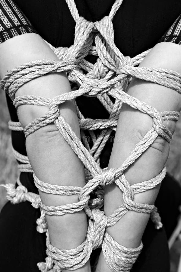 Shoulders and arms tied in shibari style royalty free stock photography.