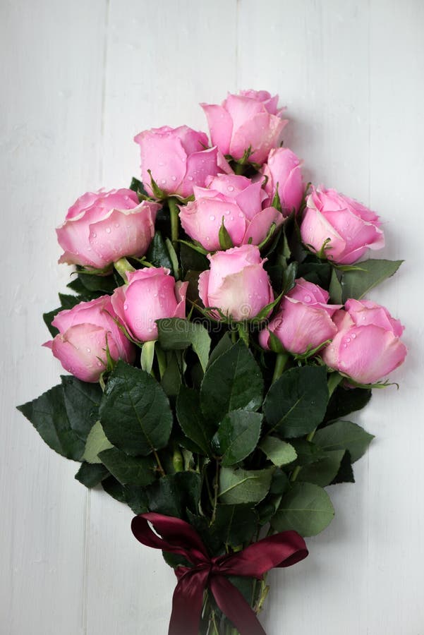 Bouquet of beautiful pink roses. On White Wooden Background, shallow DOF, selective focus royalty free stock photos Bouquet of beautiful pink roses. On White Wooden Background, shallow DOF, selective focus royalty free stock photos
