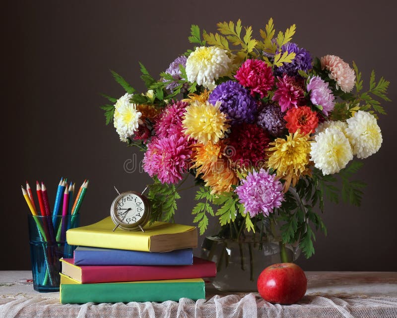 Bouquet and book. Back to school. September 1. royalty free stock photography Bouquet and book. Back to school. September 1. royalty free stock photography