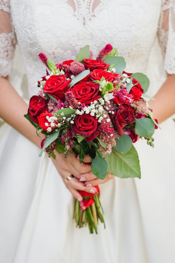 Bouquet of the bride in the hands of wedding rings royalty free stock photo Bouquet of the bride in the hands of wedding rings royalty free stock photo