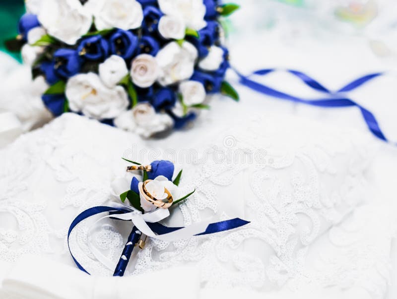 A Bouquet of the Bride from White and Blue Roses and Wedding Rings from ...