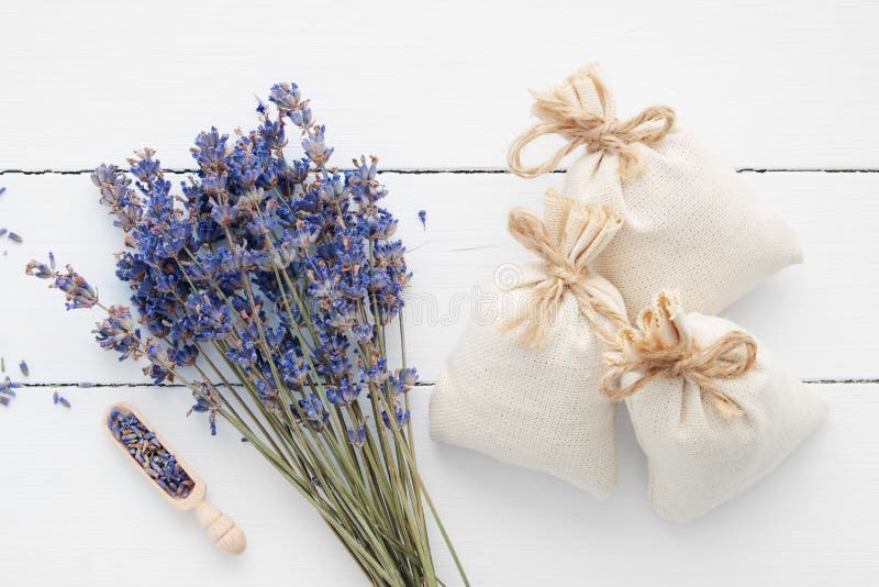 Bouquet of dry lavender flowers and sachets filled with dried lavender. Top view. Flat lay. Bouquet of dry lavender flowers and sachets filled with dried lavender. Top view. Flat lay.