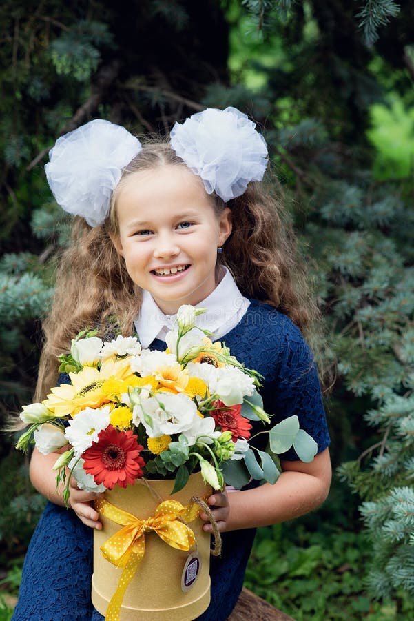 bouquet for first beloved teacher on first of September. Flowers for the last bell. day of knowledge. beginning of the school year royalty free stock images bouquet for first beloved teacher on first of September. Flowers for the last bell. day of knowledge. beginning of the school year royalty free stock images