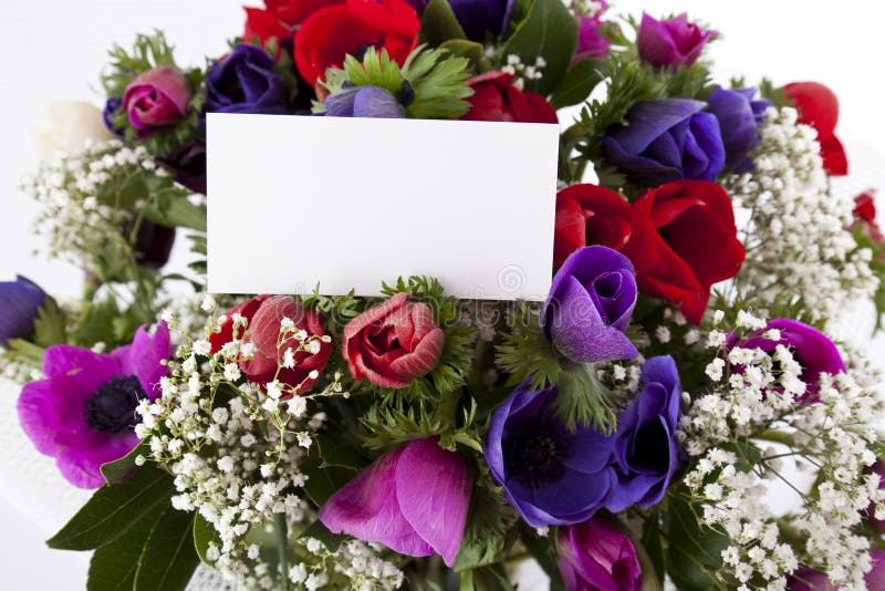 Bouquet of flowers with blank white card