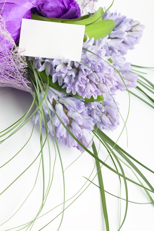 Bouquet of flowers with blank white card