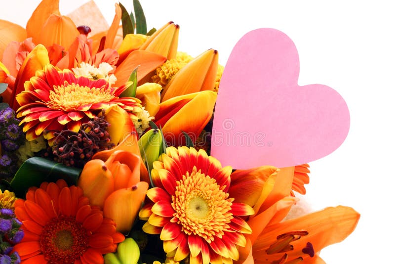 Bouquet of Flowers with a Note in the Form of a Heart. Stock Photo