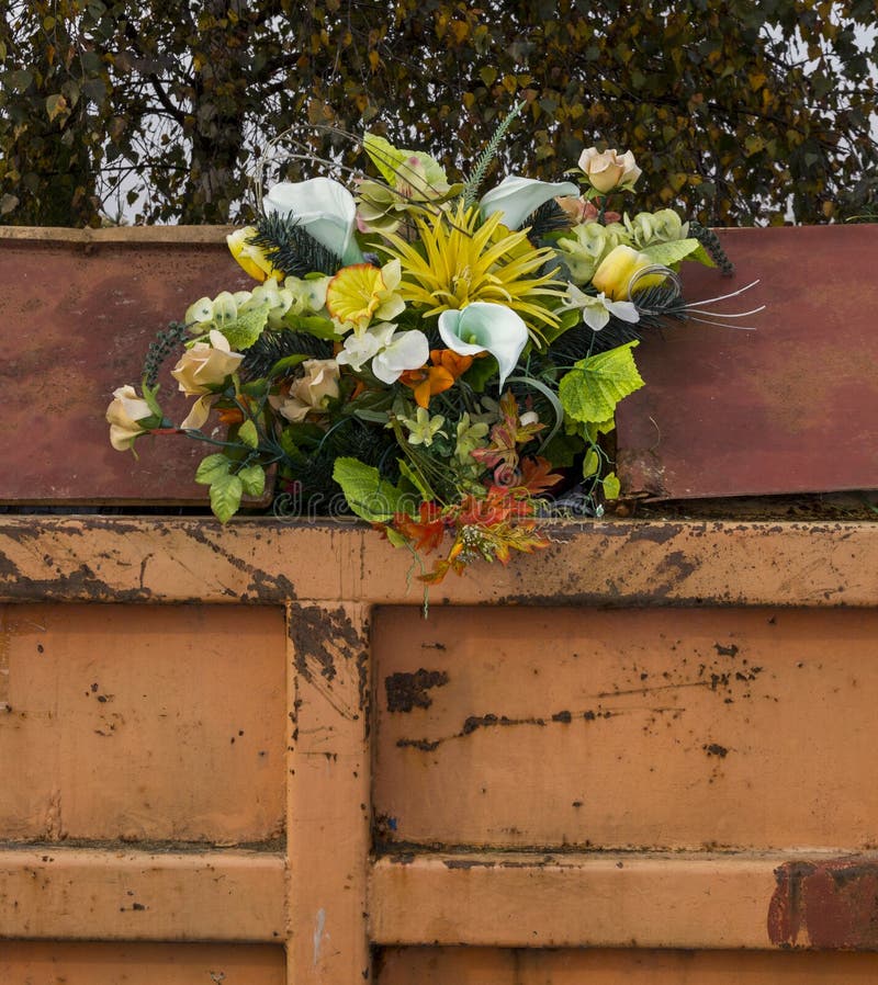 Bouquet of Flowers Sticking Out from a Trash Container Stock Image - Image  of throw, away: 34709765