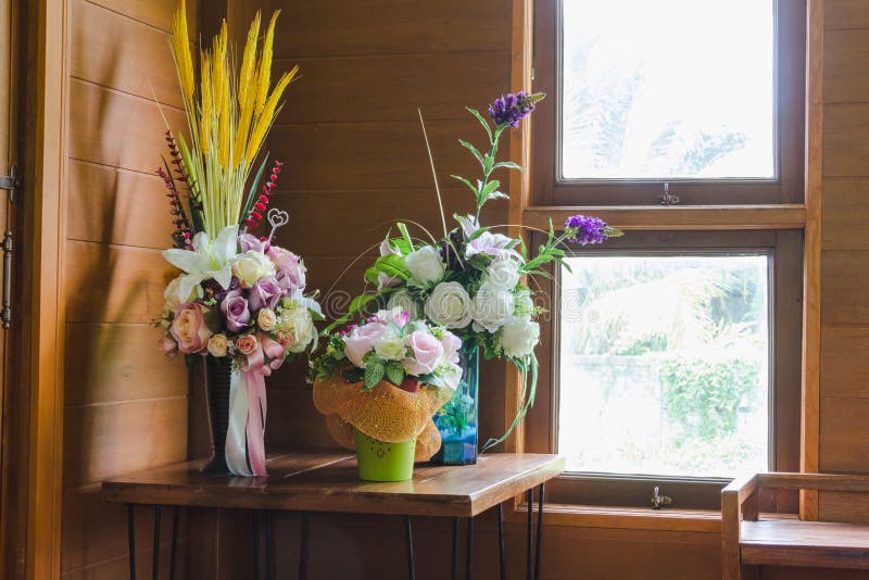 Bouquet in jar decoration on wood wall