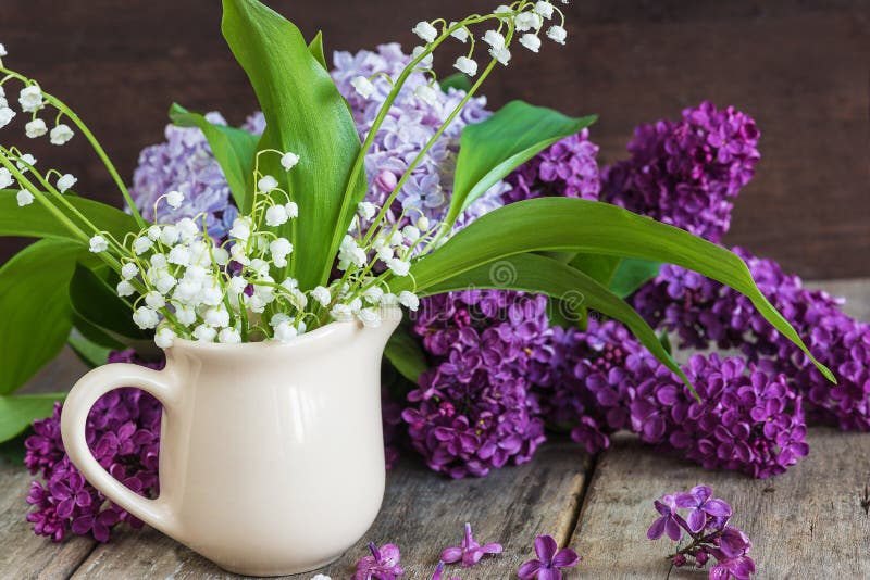 Bouquet of lilies of the valley and lilac flowers