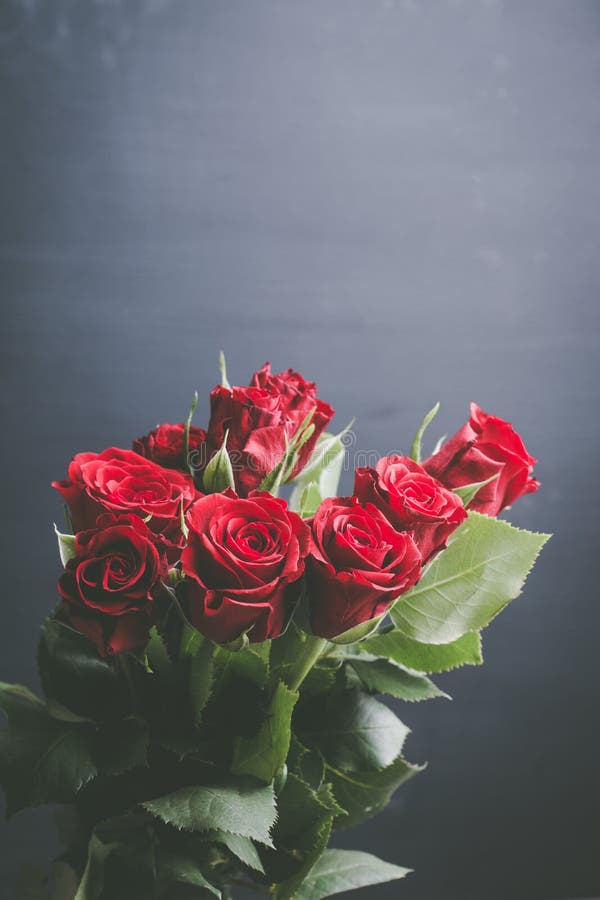 Download Bouquet With Red Roses On The Rustic Background Stock ...