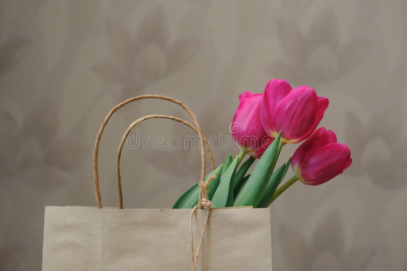 Bouquet of red tulips in paper bag stock photography Bouquet of red tulips in paper bag stock photography