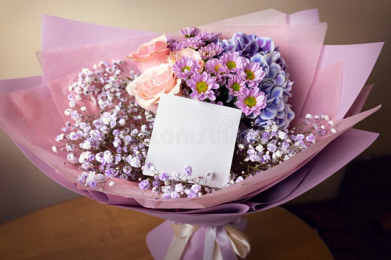 Bouquet with roses, gypsophila, chrysanthemum, hydrangea with empty greeting card