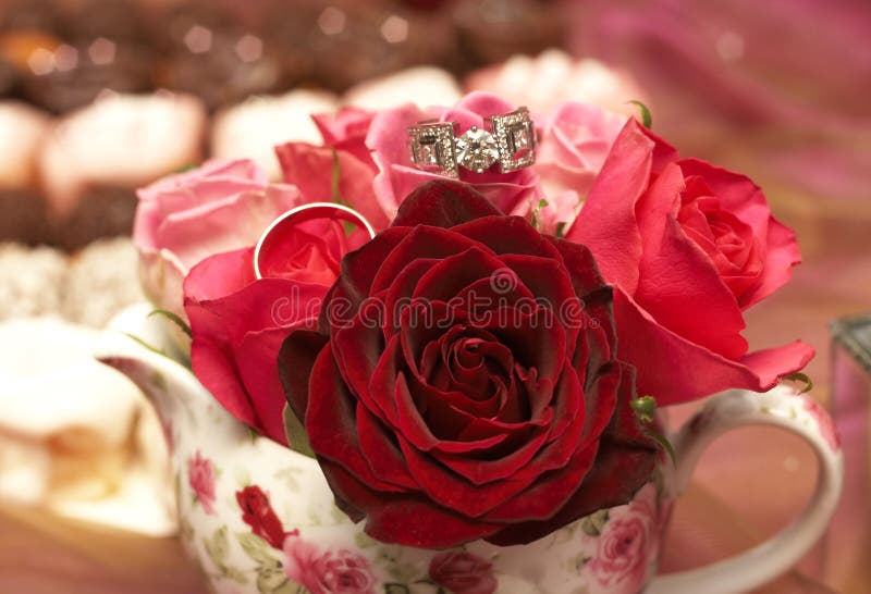 Bouquet of roses with wedding rings