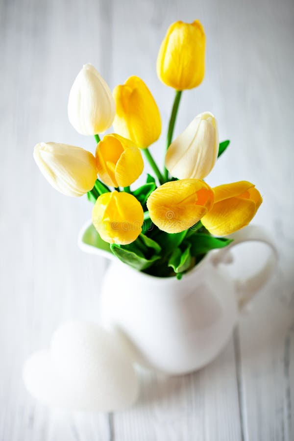 Bouquet of spring tulips on a bright background. Greeting card. Space for text. stock images