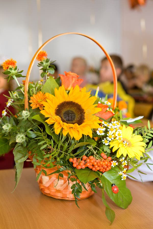 Bouquet teacher on September 1. Beginning of the school year. A bright bouquet of sunflowers, mountain ash, roses. Classroom.