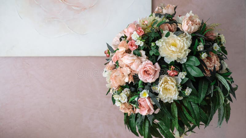 bouquet of yellow and pink flowers against the background of the pink wall stock photos bouquet of yellow and pink flowers against the background of the pink wall stock photos