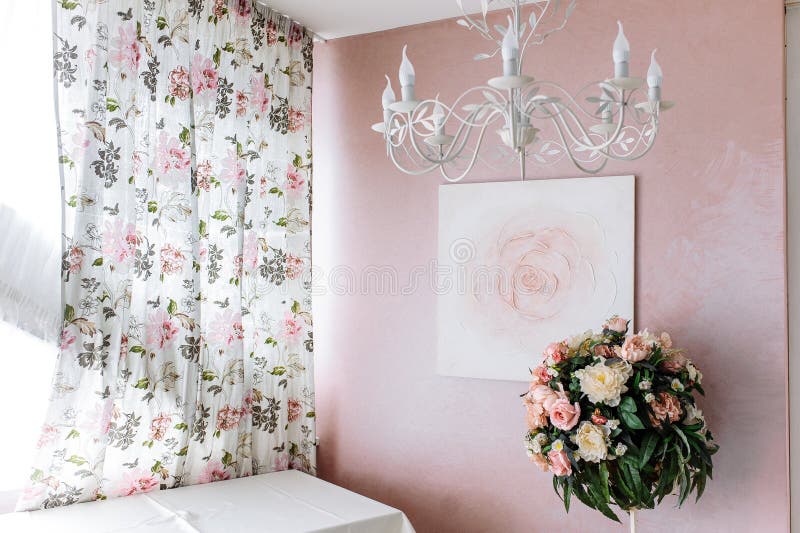 Bouquet of yellow and pink flowers against the background of the image of a rose on a pink wall stock photography Bouquet of yellow and pink flowers against the background of the image of a rose on a pink wall stock photography