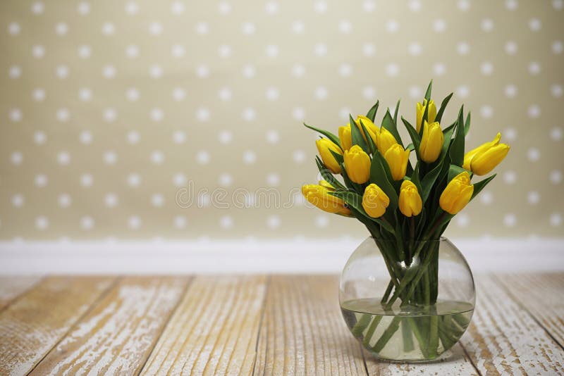 A Bouquet of Yellow Tulips in a Vase on the Floor. a Gift To a W Stock ...