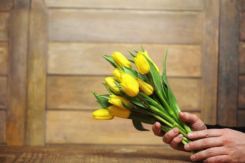 A Bouquet of Yellow Tulips in a Vase on the Floor. a Gift To a W Stock ...