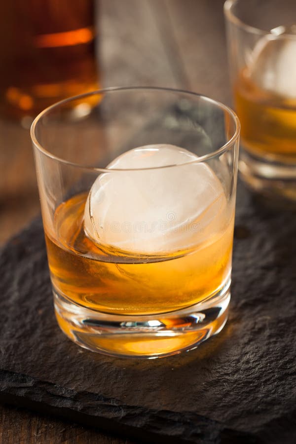 Bourbon Whiskey with a Sphere Ice Cube Stock Photo Image of elegance