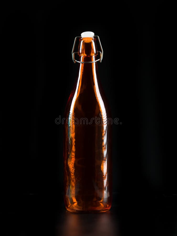 Bouteille orange transparente image stock Bouteille orange transparente image stock