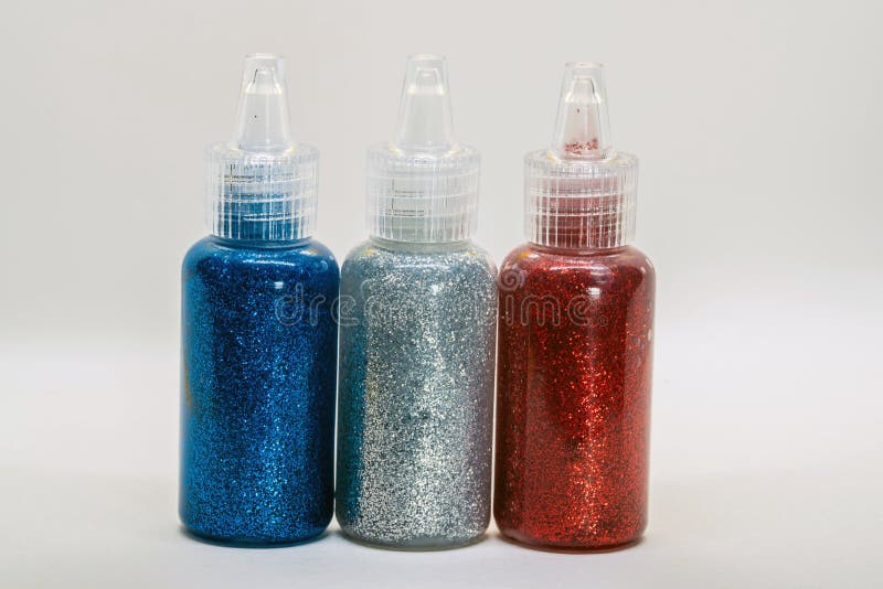 Bouteilles éclatantes avec la colle photo libre de droits Bouteilles éclatantes avec la colle photo libre de droits