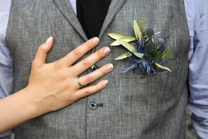 The Boutonniere in the pocket of the suits of the groom of eucalyptus and Eryngium. The Boutonniere in the pocket of the suits of the groom of eucalyptus and Eryngium