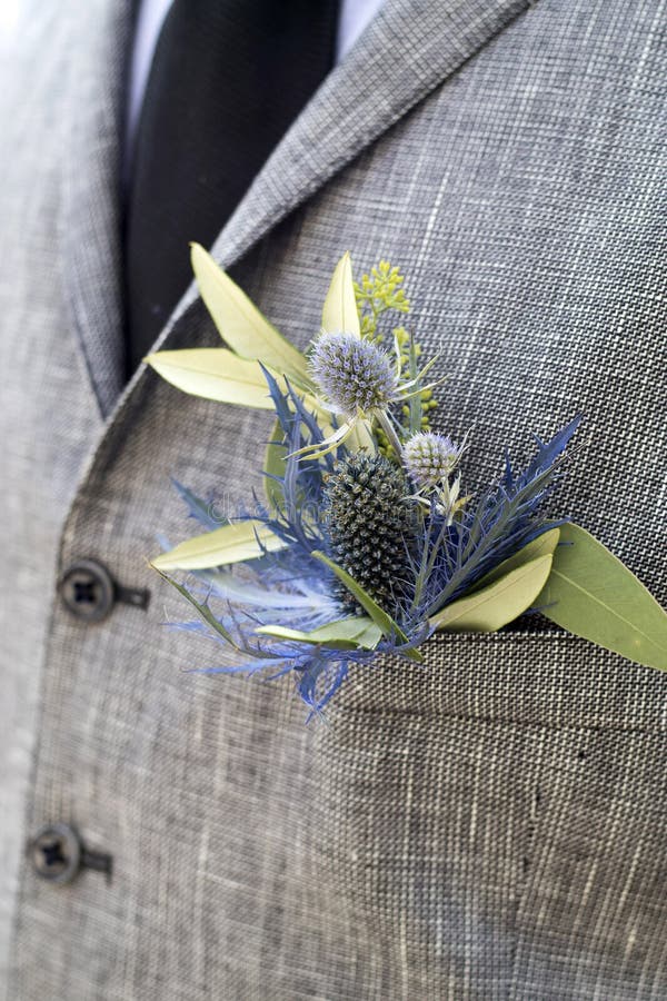 The Boutonniere in the pocket of the suits of the groom of eucalyptus and Eryngium. The Boutonniere in the pocket of the suits of the groom of eucalyptus and Eryngium