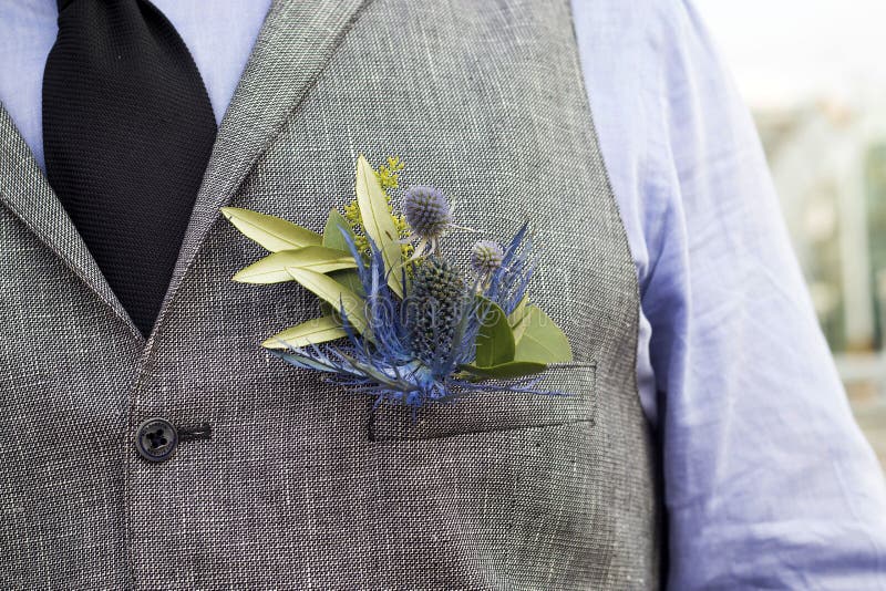 The Boutonniere in the pocket of the suits of the groom of eucalyptus and Eryngium. The Boutonniere in the pocket of the suits of the groom of eucalyptus and Eryngium