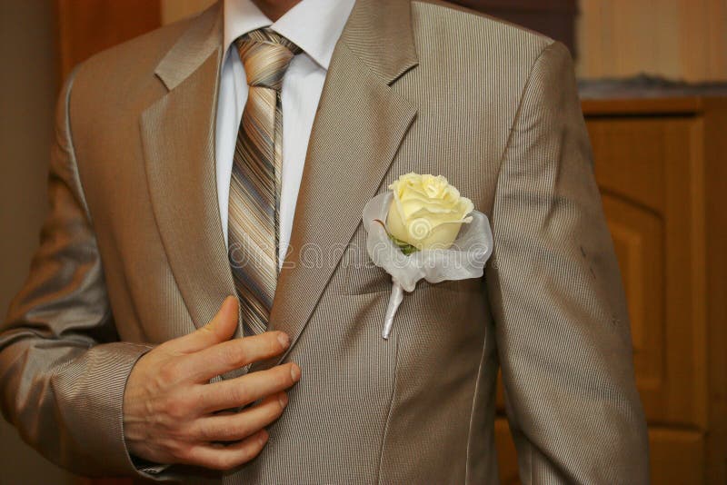 Boutonniere on the groom`s wedding suit