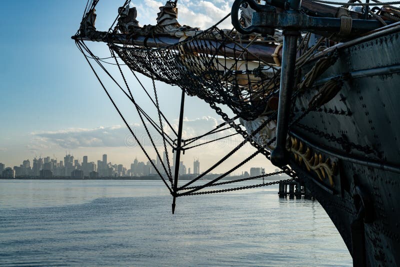 Bow and Bowsprit Rigging of Sailing Ship in Dock and Melbourne Skyline As Background Stock Image