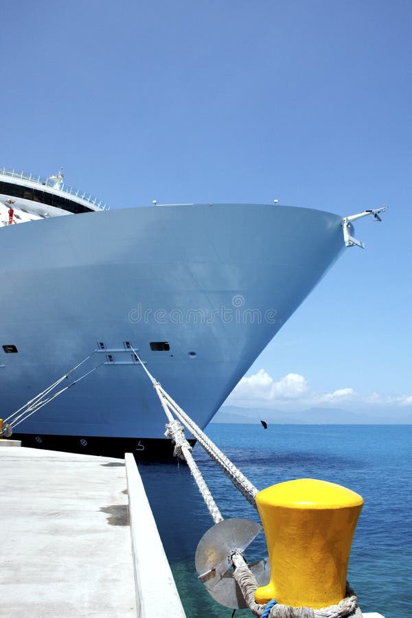 Bow of Cruise Ship Tied to Yellow Bollard