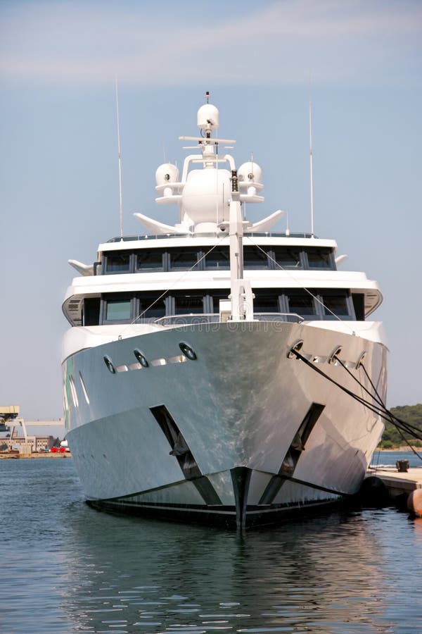 Bow of large modern white yacht anchored in the port stock images Bow of large modern white yacht anchored in the port stock images