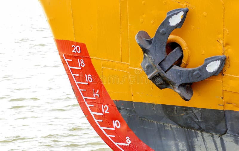 Bow of a ship with draft scale numbering and anchor