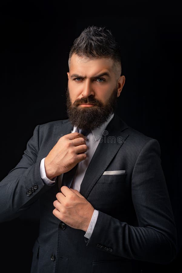 Bow-tie trend. Meeting suit. Boss. Businessman in dark grey suit with long beard. Man in classic suit, shirt and tie.