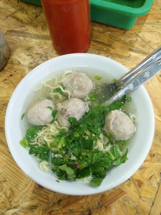 A bowl of Bakso or Indonesian beef meatball. It is popular street food in Indonesia. Usually it served with yellow noodles and rice vermicelli. A bowl of Bakso or Indonesian beef meatball. It is popular street food in Indonesia. Usually it served with yellow noodles and rice vermicelli.