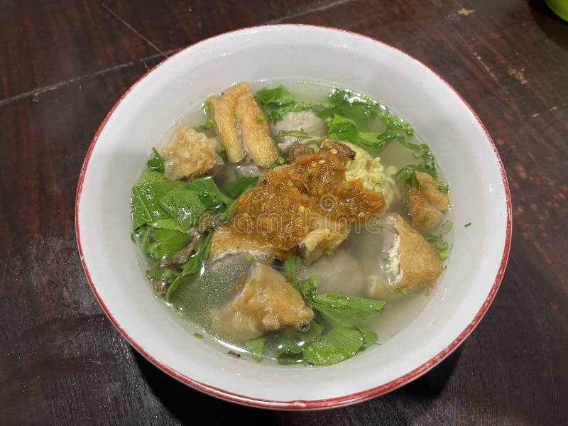 A bowl of Bakso which is Indonesian famous street food consist of meat ball, noodle and beef broth.