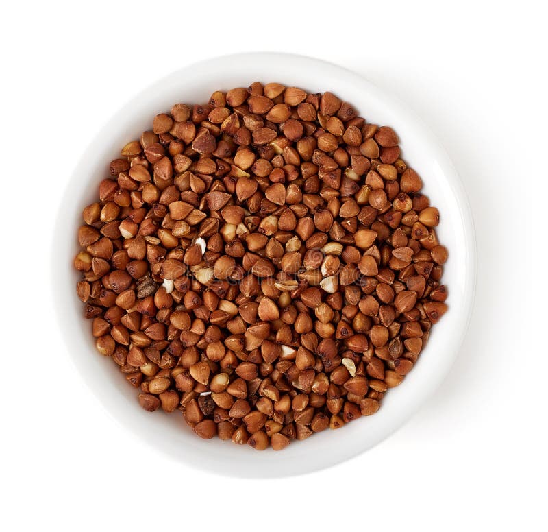 Bowl of buckwheat on white background, top view