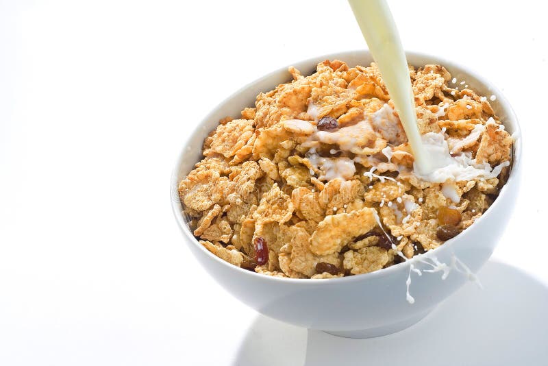 Pouring Milk into a Bowl with Granola Stock Photo - Image of pouring ...