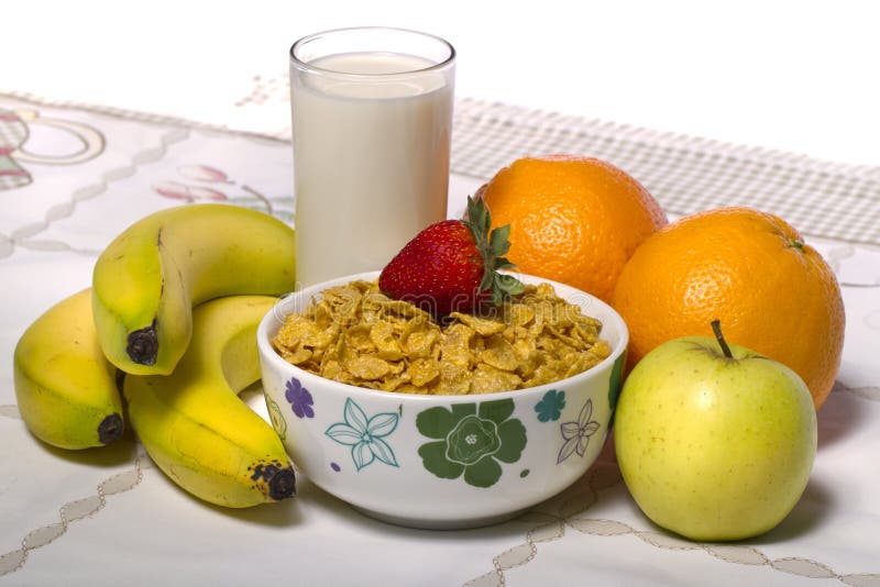 Bowl of cereals with fruit and milk