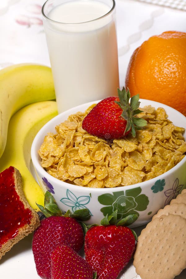 Bowl of cereals with fruit and milk