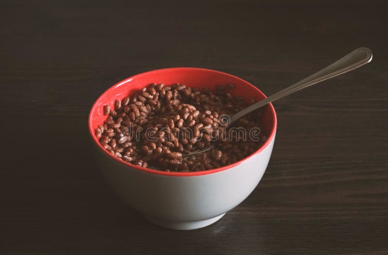 Bowl with Chocolate Cereals in Milk with Spoon, Eating Breakfast Stock