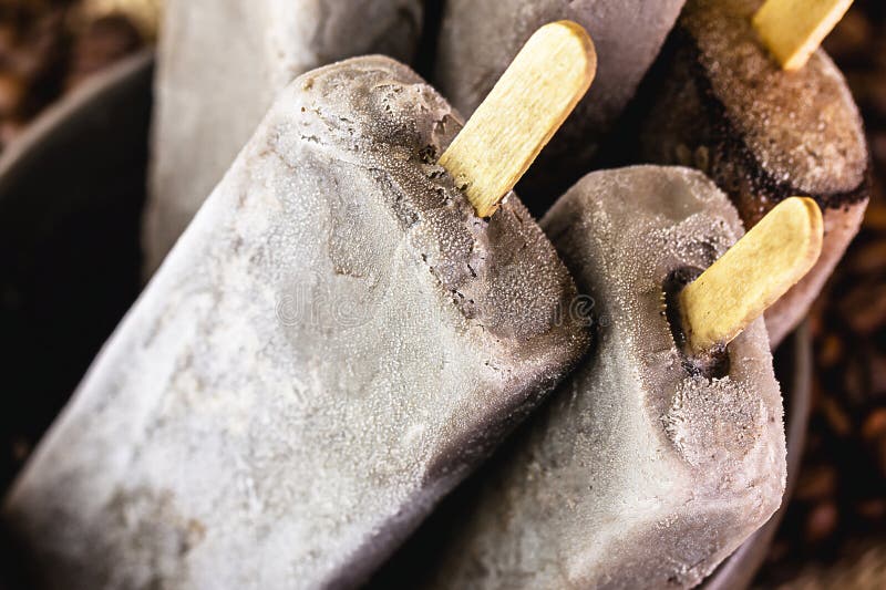 bowl with coffee flavored popsicles. Cold dessert, cappucino popsicle, pop ice.