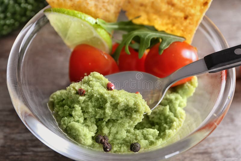 Bowl with delicious guacamole and vegetables, closeup royalty free stock image