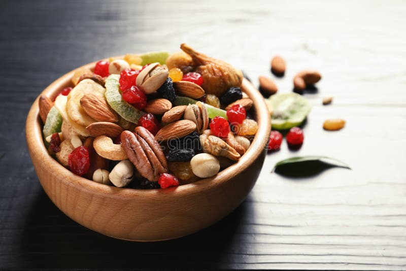 Bowl of Different Dried Fruits and Nuts on Table. Stock Photo Image
